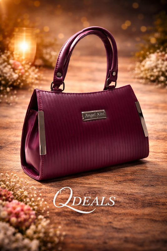 Purple handbag with 'Angel Kiss' label on a wooden surface, surrounded by flowers.