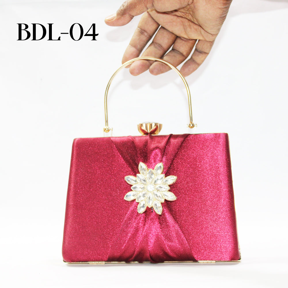 Pink handbag with a decorative flower on a white background
