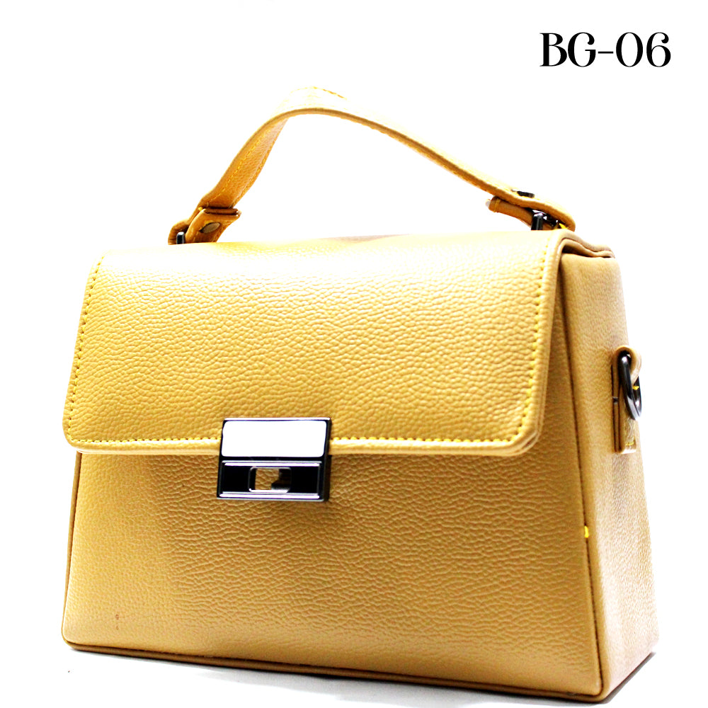Yellow handbag with a silver clasp on a white background