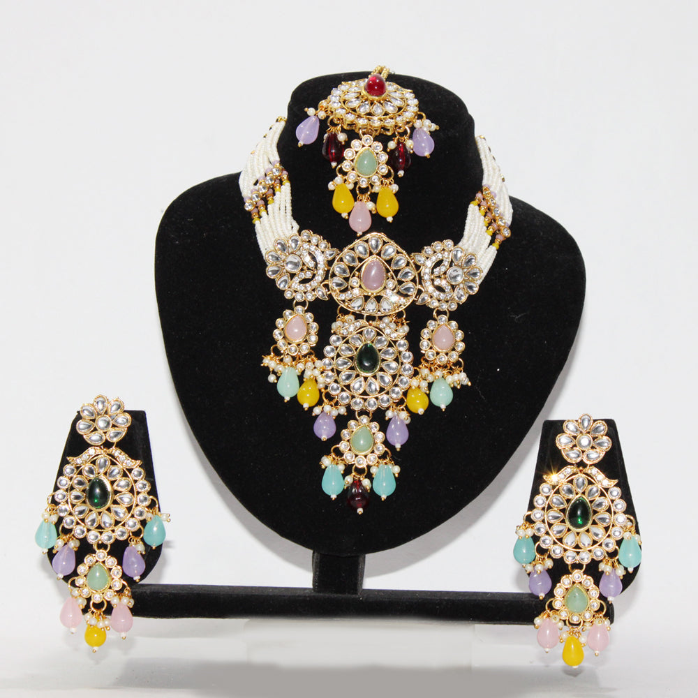 Jewelry set with necklace and earrings on a black stand against a white background