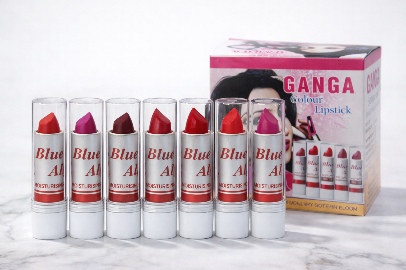 Set of Blue Alkali lipsticks with a Ganga lipstick box on a white background