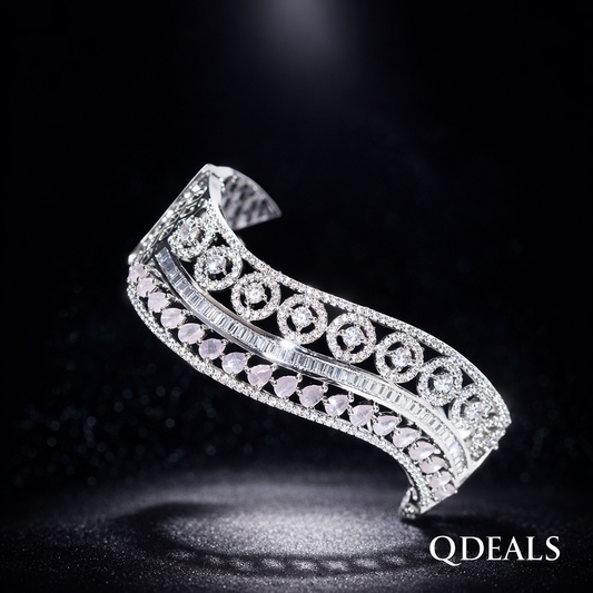 Silver bracelet with intricate design on a dark background, branded 'QDEALS'.