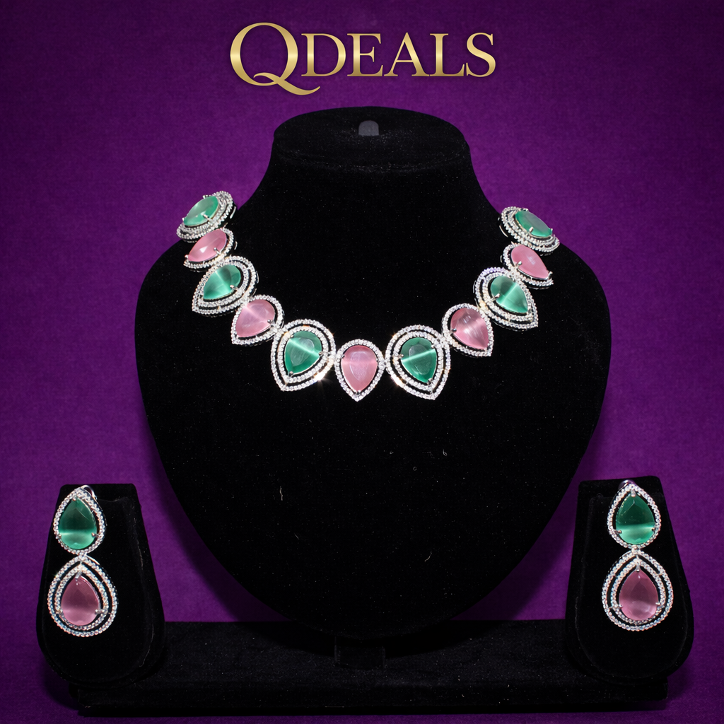 Jewelry set with necklace and earrings on a black stand against a purple background, branded 'QDEALS'.
