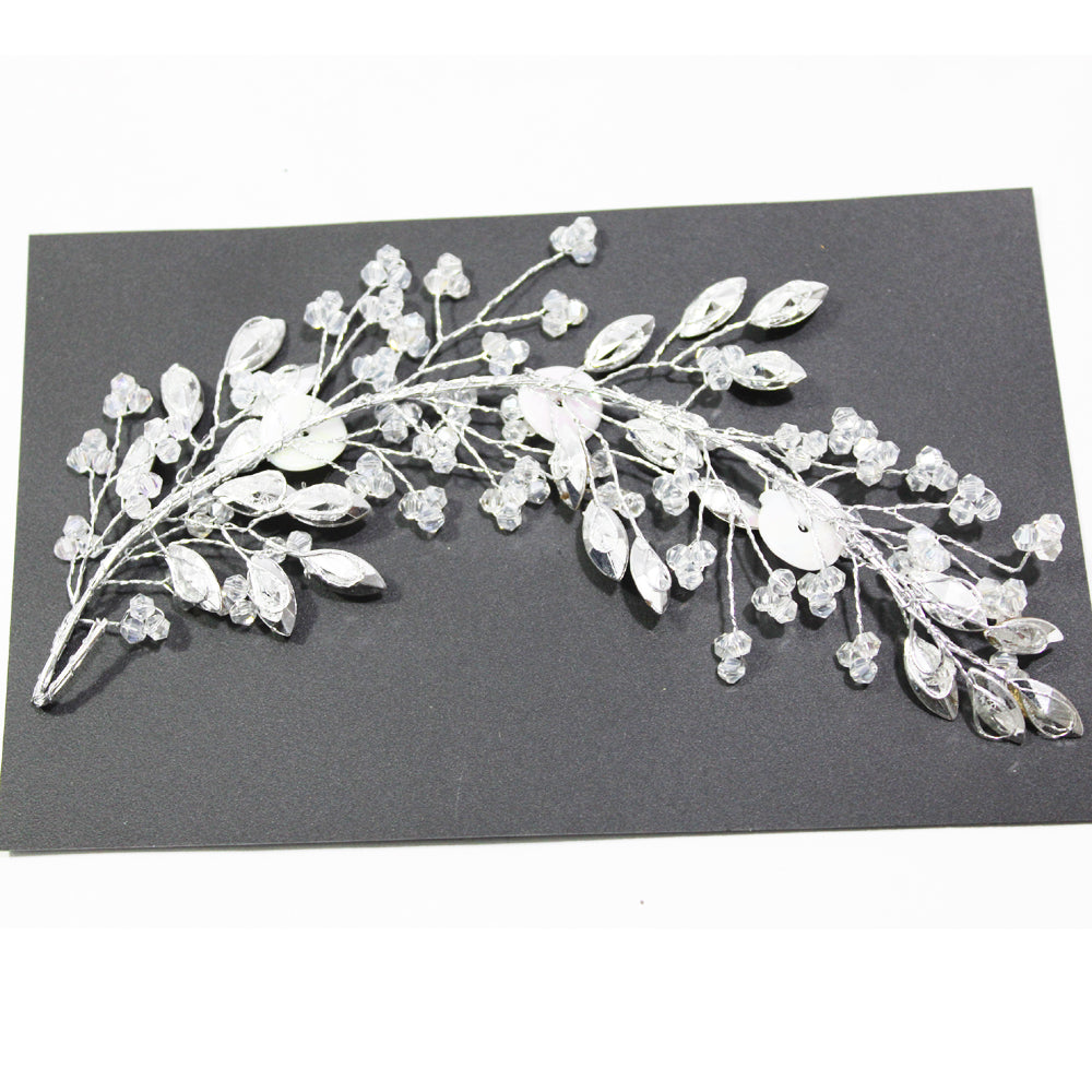 Silver hair vine with crystals on a black card