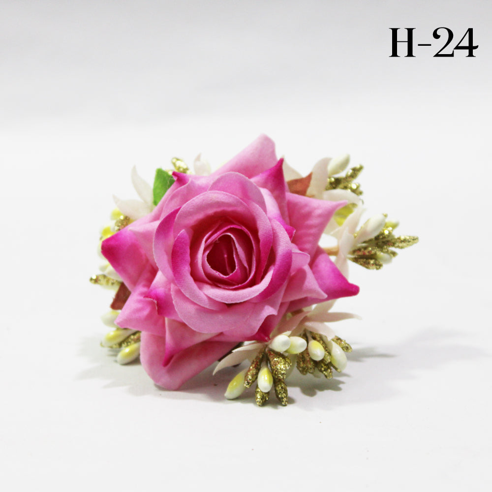 Pink rose with white and green leaves on a light gray background