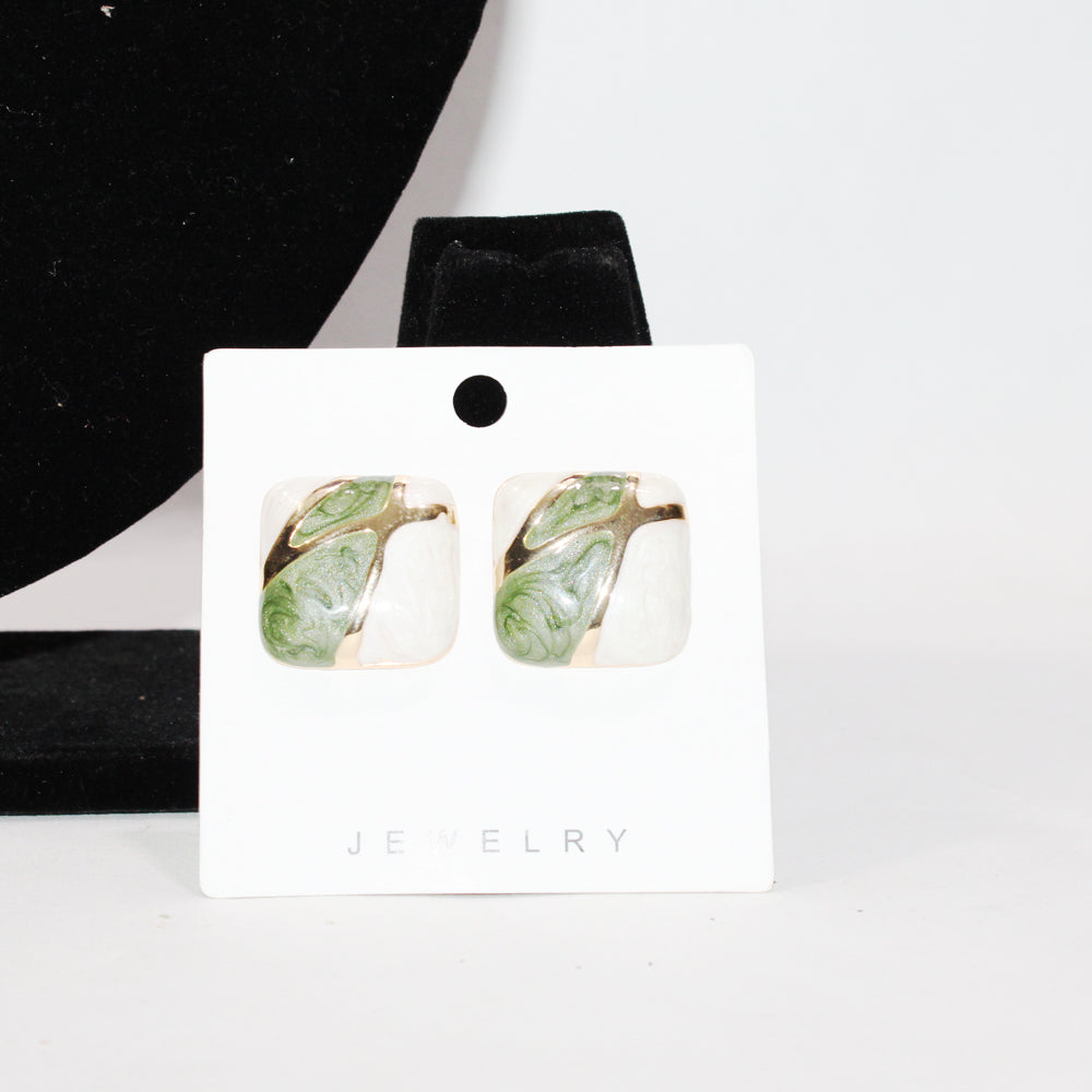 Jewelry card with green leaf-shaped earrings on a white background