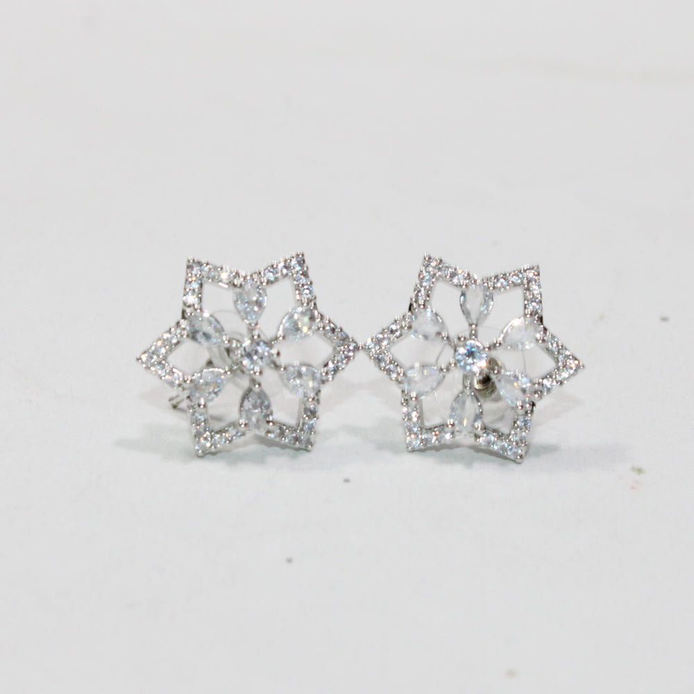 Pair of silver butterfly-shaped earrings on a light gray background